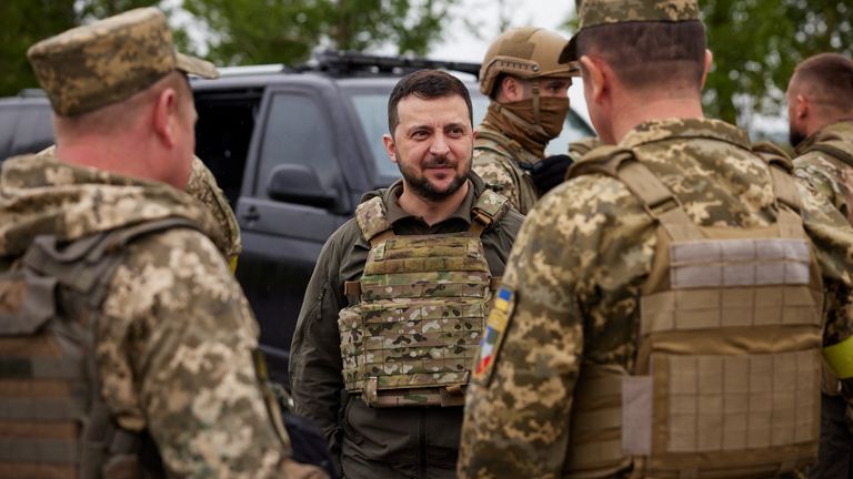 Ukraine&#39;s President Volodymyr Zelenskyy visits the location of a fight with Russian troops