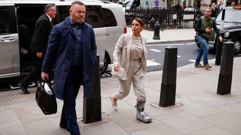 Wayne Rooney and his wife Coleen Rooney arrive at the High Court