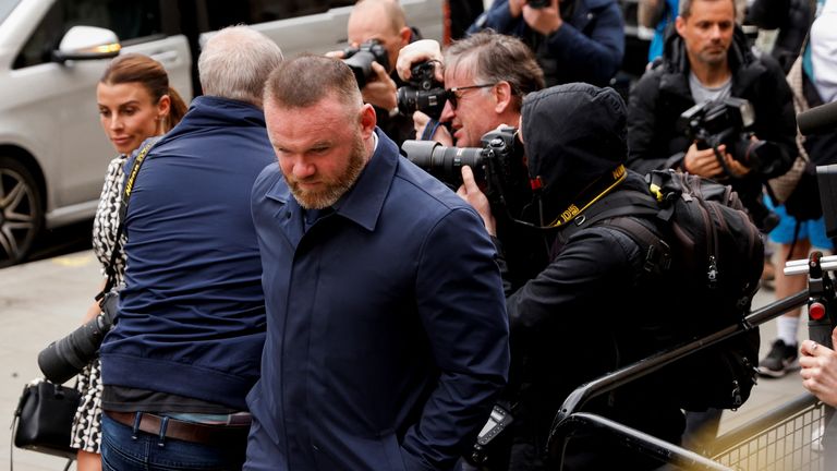 Derby County manager Wayne Rooney and his wife Coleen Rooney arrive at the Royal Courts of Justice in London, Britain May 11, 2022. REUTERS/John Sibley
