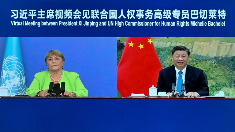 In this photo released by Xinhua, a screen shows Chinese President Xi Jinping, right, holding a virtual meeting with United Nations High Commissioner for Human Rights Michelle Bachelet, Wednesday, May 25 2022. Xi defended China's record with the United Nations' top human rights official on Wednesday, saying each country should be allowed to find its own path based on its particular circumstances. themselves and criticize countries that lecture others about human rights and politicize the issue.  (Yue Yuewei