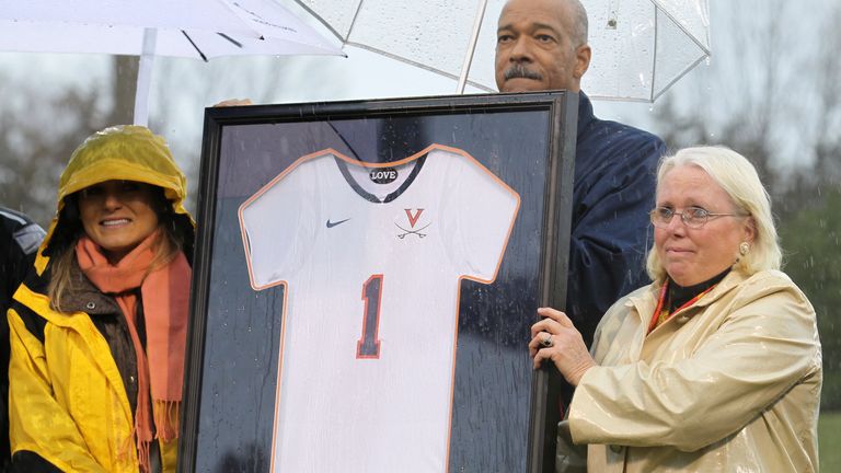 Murder of Yeardley Love by boyfriend George Huguely. Before the start of the women&#39;s lacrosse game between University of Virginia and Penn State at Kl..ckner Stadium, University of Virginia Athletics Director Craig Littlepage presented Yeardley Love&#39;s sister Lexie and mother Sharon with a jersey with Yeardley&#39;s number Sunday, Mar. 6, 2011.  The university is retiring Love&#39;s number.  Photo/The Daily Progress/Sabrina Schaeffer