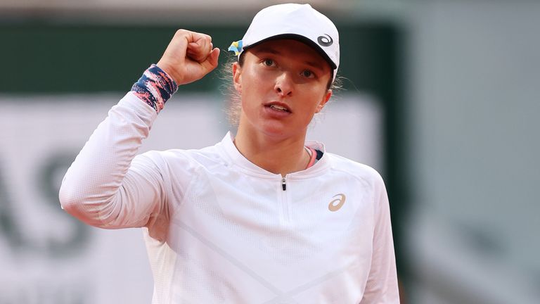 Iga Swiatek of Poland celebrates match point against Qinwen Zheng of China during the Women&#39;s Singles Fourth Round match on Day 9 of The 2022 French Open at Roland Garros on May 30, 2022 in Paris, France. (Photo by Ryan Pierse/Getty Images)