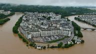 This photo released by Xinhua News Agency via AP shows flooded areas of Wuyuan County, in southeastern China&#39;s Jiangxi province