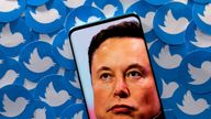 FILE PHOTO: An image of Elon Musk is seen on smartphone placed on printed Twitter logos in this picture illustration taken April 28, 2022. REUTERS/Dado Ruvic/Illustration/File Photo/File Photo
