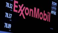The logo of Exxon Mobil Corporation is shown on a monitor above the floor of the New York Stock Exchange in New York
