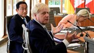 Boris Johnson gestures during a G7 round table meeting in Germany