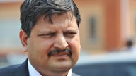In this photo taken in September 2010 Atul Gupta is seen outside magistrates courts in Johannesburg. The wealthy Gupta family has been criticized or allegedly improper links to president Jacob Zuma. The Gupta family denies that it is corrupt but does not directly address accusations that it tried to boost business by influencing some of Zuma&#39;s choices for Cabinet posts, even allegedly offering the finance minister&#39;s job to an official. (AP Photo) SOUTH AFRICA OUT


