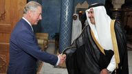The Prince of Wales shakes hands with the Qatari Prime Minister Sheikh Hamad Bin Jassim al Thani, at his residence outside Doha, Qatar, during a visit in 2013