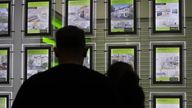 ile photo dated 18/12/16 of people looking at homes for sale in an estate agents window. The average price tag on a home in Britain has topped �350,000 for the first time, according to website Rightmove.
Read less