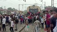 Demonstrators block a train in Jehanabad