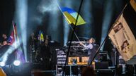 Paul McCartney waves the Ukrainian flag while performing on the Pyramid stage at Glastonbury Festival in Worthy Farm, Somerset, England, Saturday, June 25. Pic: AP