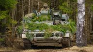 British soldiers mount armoured vehicles on manoeuvres in Estonia on NATO exercise Bold Dragon