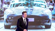 FILE PHOTO: Tesla Inc CEO Elon Musk walks next to a screen showing an image of Tesla Model 3 car during an opening ceremony for Tesla China-made Model Y program in Shanghai, China January 7, 2020. REUTERS/Aly Song/File Photo

