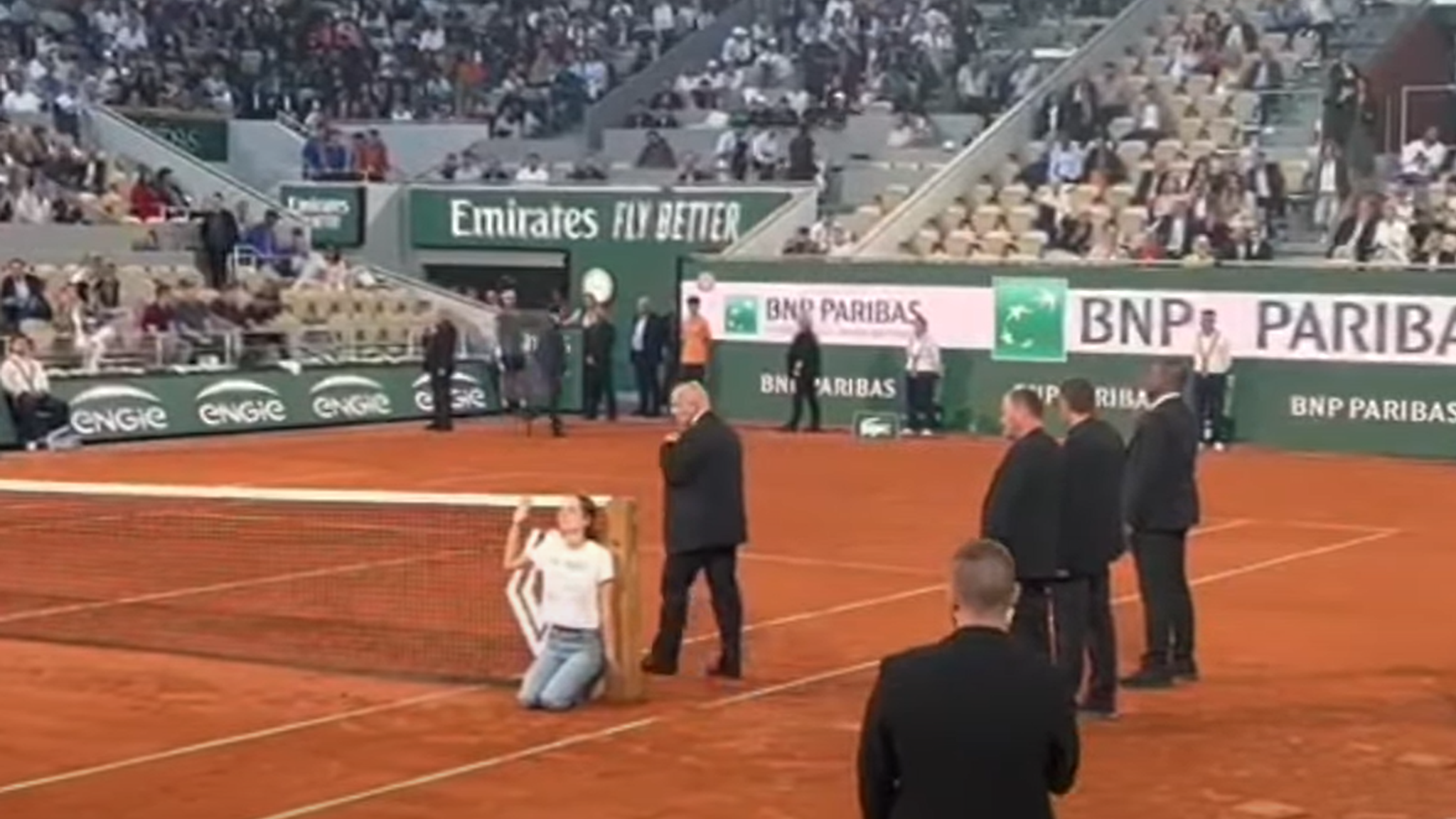 Watch: Protester at French Open ties herself to net