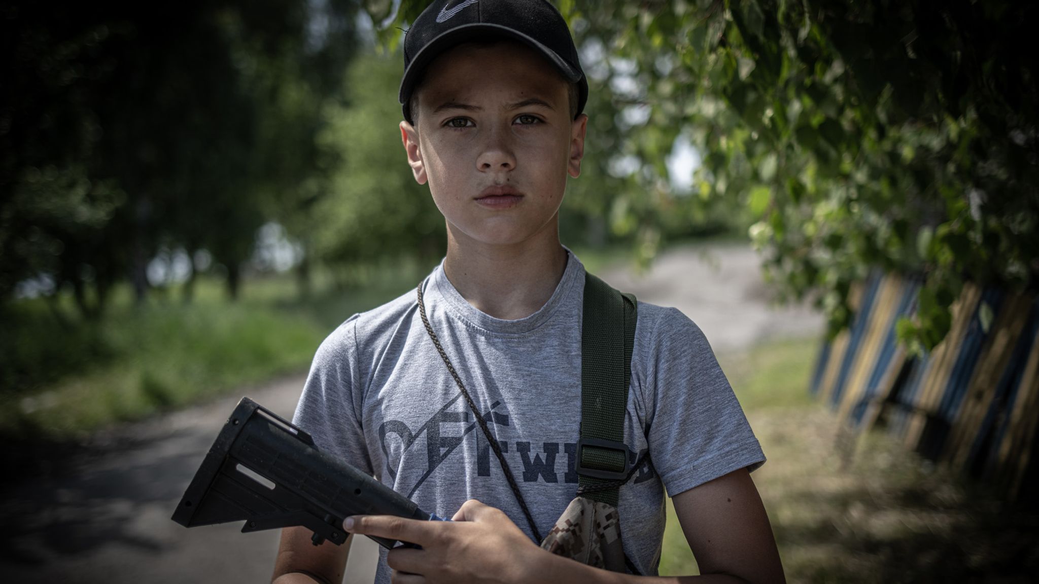 Ukraine war: Children with toy guns manning checkpoints, while body ...