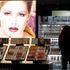 People look at L&#39;Oreal cosmetics in a shop in Riga April 13, 2012