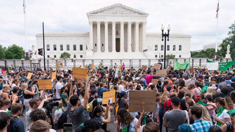 Protesters gather outside the Supreme Court in Washington, Friday, June 24, 2022. The Supreme Court has ended constitutional protections for abortion that had been in place nearly 50 years, a decision by its conservative majority to overturn the court&#39;s landmark abortion cases. (AP Photo/Jacquelyn Martin)