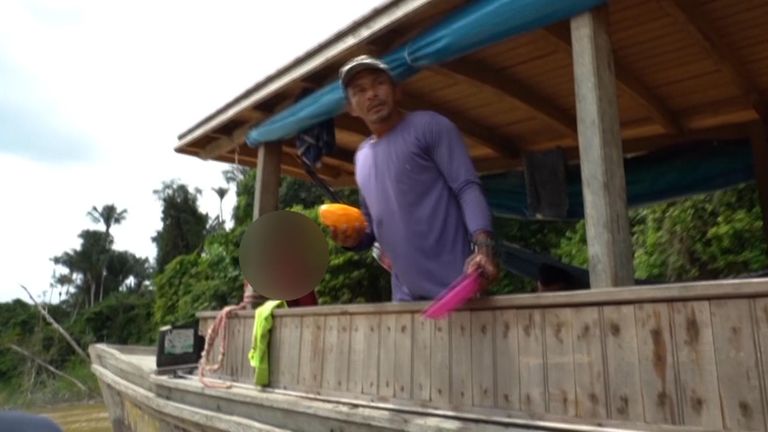 Amarildo da Costa de Oliveira, a suspect in the Amazon killings case, seen on a boat in 2021