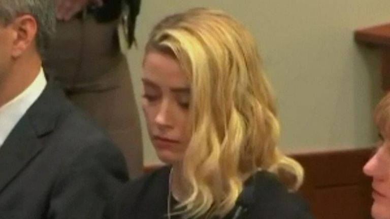 Amber Heard downcast as the verdict in her defamation trial against Johnny Depp was read out