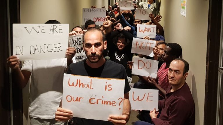 Refugees, including Mostafar Azimitabar, protest inside the Mantra Hotel Detention Facility in Melbourne. 2020