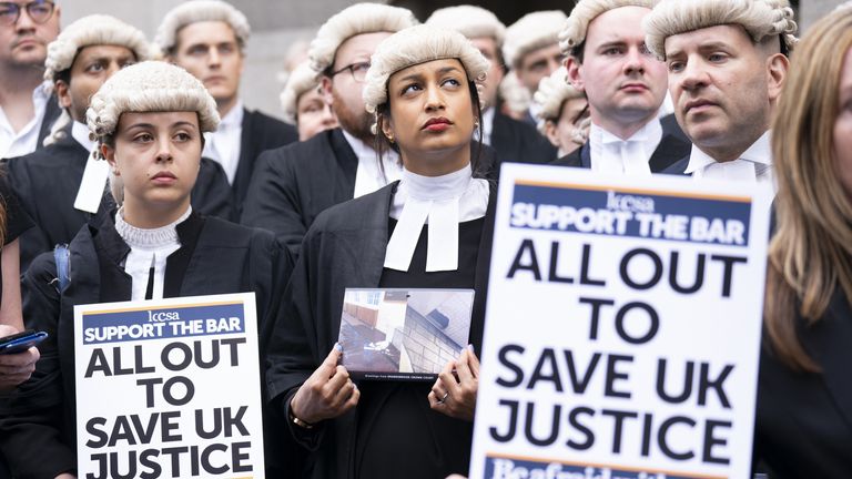 Criminal barristers from the Criminal Bar Association (CBA), which represents barristers in England and Wales, outside the Old Bailey, central London, on the first of several days of court walkouts by CBA members in a row over legal aid funding. Picture date: Monday June 27, 2022.