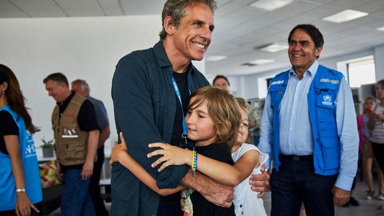 Goodwill Ambassador actor Ben Stiller embraces children at a UNHCR Protection Hub providing psycho-social support, SGBV prevention and response and child protection and legal aid services in Medyka, Poland June 18, 2022. 