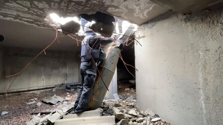 Ukrainian rescuers removed a 500-kilogram air-dropped bomb from the roof of a residential building in Kharkiv.