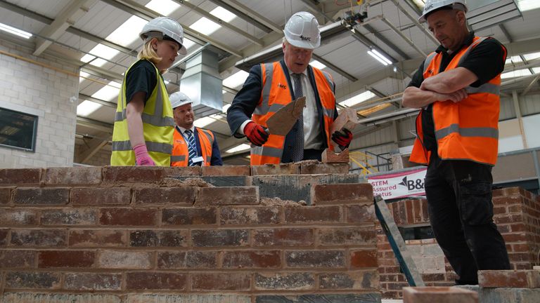 Prime Minister Boris Johnson takes part in a brick laying lesson at Blackpooland The Fylde College in Blackpool, Lancashire where he announced new measures to potentially help millions onto the property ladder. Picture date: Thursday June 9, 2022.
