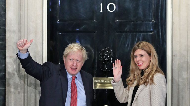 Boris Johnson and his girlfriend Carrie Symonds arrive in Downing Street after the Conservative Party was returned to power
