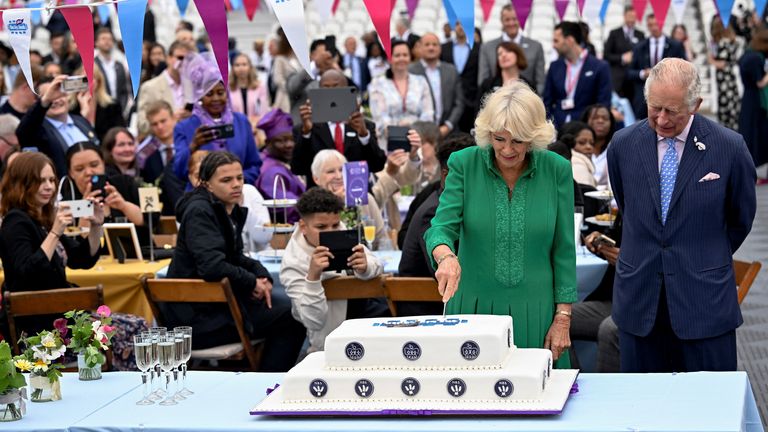  Camilla, Duchess of Cornwall, cuts a cake as she  Prince Charles attend a Big Jubilee Lunch at The Oval