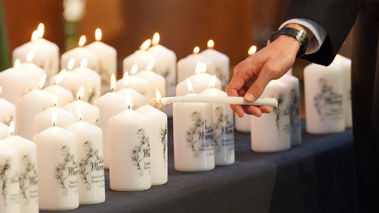 Candles with the names of the victims are lit during the Grenfell fire memorial service at Westminster Abbey in London, in remembrance of those who died in the Grenfell Tower fire on June 14 2018. Picture date: Tuesday June 14, 2022.