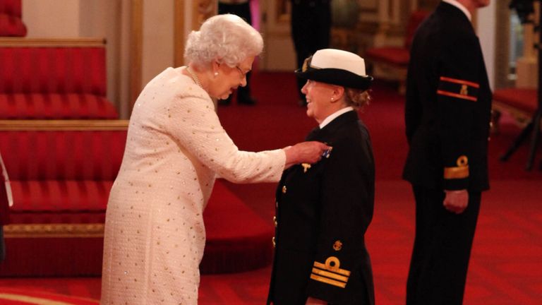 Commander Carol Betteridge, Queen Alexandra&#39;s Royal Naval Nursing Service, is made an OBE, for services in Afghanistan, by Queen Elizabeth II at Buckingham Palace. PRESS ASSOCIATION Photo. Picture date: Friday October 19, 2012. See PA story ROYAL Investiture. Photo credit should read: Lewis Whyld/PA Wire