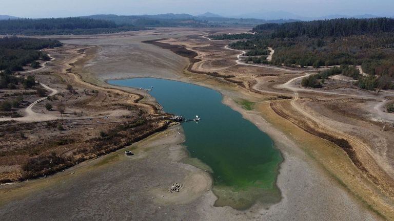 A general view of the almost-dry Penuelas lake in Valparaiso, Chile April 19, 2022. The Penuelas reservoir was until twenty years ago the main source of water for the city of Valparaiso, holding enough water for 38,000 Olympic-size swimming pools. REUTERS/Ivan Alvarado SEARCH "DROUGHT PENUELAS" FOR THIS STORY. SEARCH "WIDER IMAGE" FOR ALL STORIES