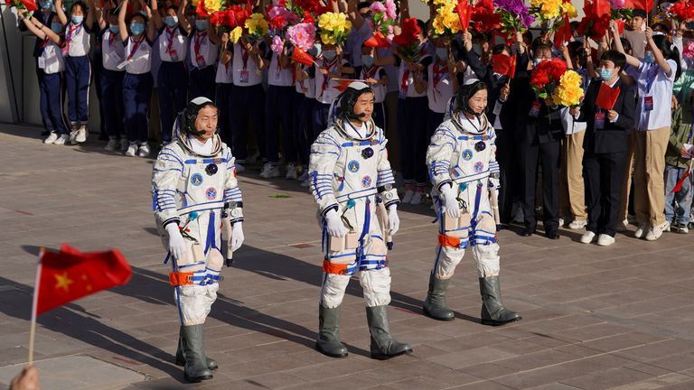 Chinese astronauts Chen Dong, Liu Yang and Cai Xuzhe attend a see-off ceremony before the launch of the Long March-2F carrier rocket, carrying the Shenzhou-14 spacecraft for a crewed mission to build China&#39;s space station, at Jiuquan Satellite Launch Center near Jiuquan, Gansu province, China June 5, 2022. China Daily via REUTERS ATTENTION EDITORS - THIS IMAGE WAS PROVIDED BY A THIRD PARTY. CHINA OUT.
