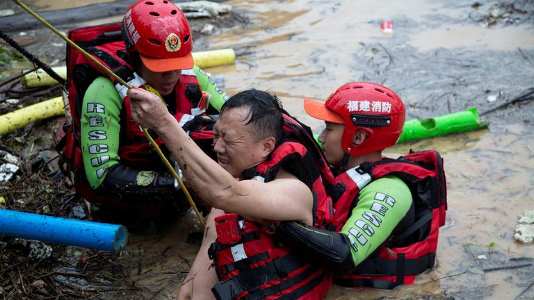 A man is rescued in Fujian province. Pic: China Daily via Reuters