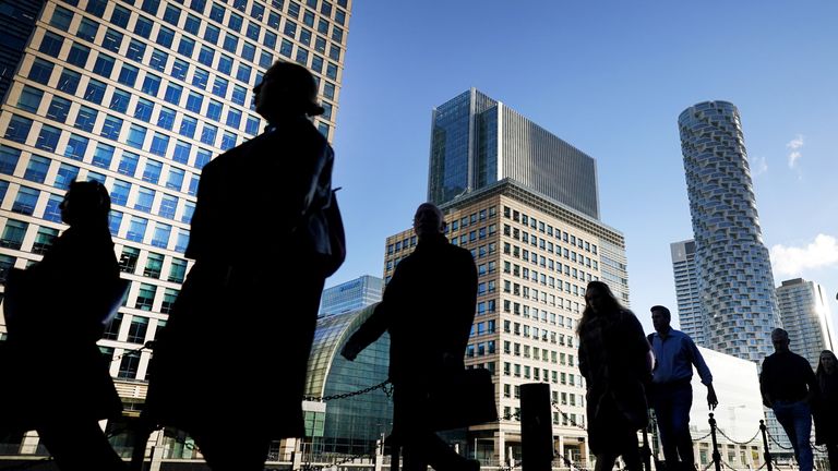 File photo dated 06/10/21 of office workers and commuters walking through Canary Wharf in London. The UK&#39;s biggest banks are no longer too big to fail and could continue to provide vital services even if they are going through a crisis, according to a report. Issue date: Friday June 10, 2022.
