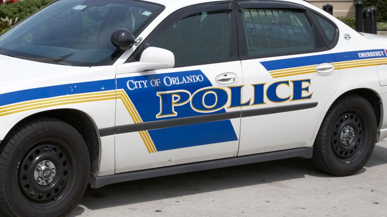 city of orlando police squad patrol car outside a shopping mall in florida usa
