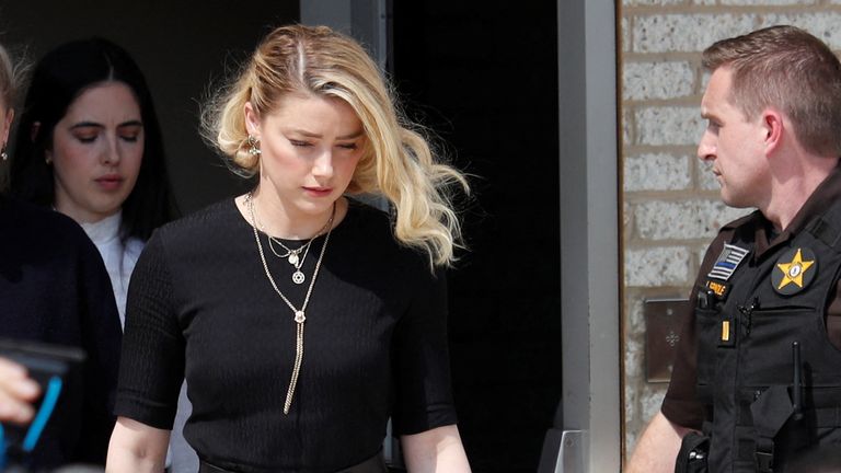 Amber Heard leaves court after the verdict