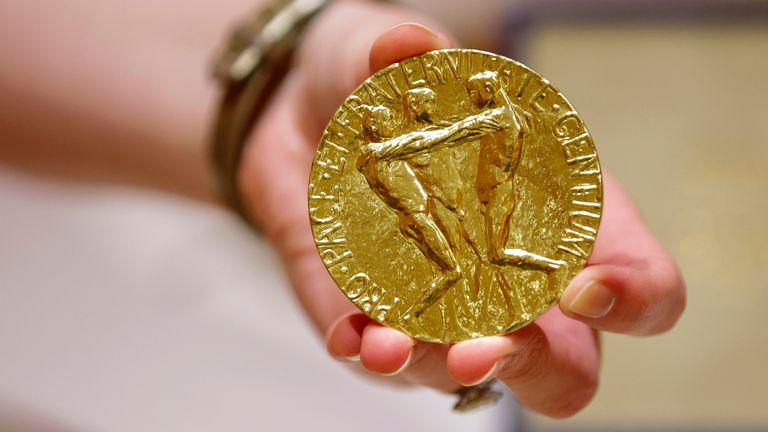 Dmitry Muratov's 23-carat gold medal in the 2021 Nobel Peace Prize Pic AP
