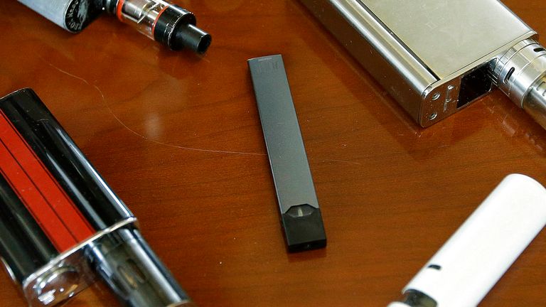 Vaping devices including one produced by Juul, pictured center Pic: AP 
