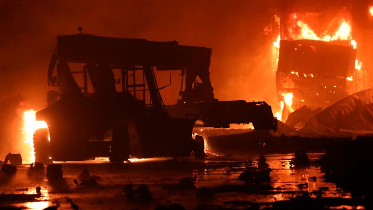 A fire rages at the BM Inland Container Depot, a Dutch-Bangladesh joint venture, in Chittagong, 216 kilometers (134 miles) southeast of capital, Dhaka, Bangladesh, early Sunday, June 5, 2022. Several people were killed and more than 100 others were injured in the fire the cause of which could not be immediately determined. (AP Photo)