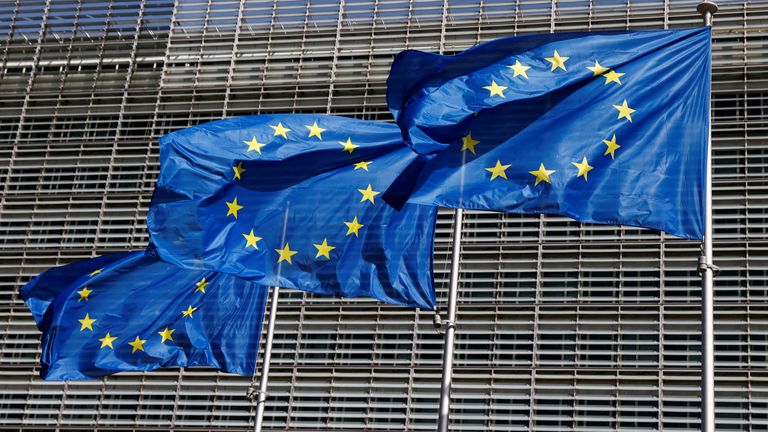 FILE PHOTO: European Union flags flutter outside the EU Commission headquarters in Brussels, Belgium June 17, 2022. REUTERS/Yves Herman/File Photo