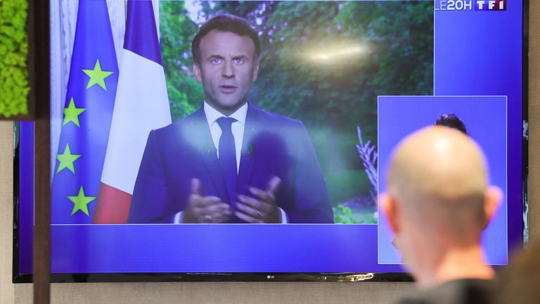French President Emmanuel Macron while he addresses the nation on Wednesday evening