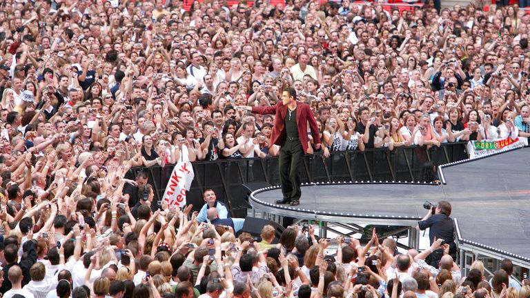 George Michael on stage at the then newly opened Wembley Stadium in June 2007. Pic: AP Photo/Irina Kalashnikova