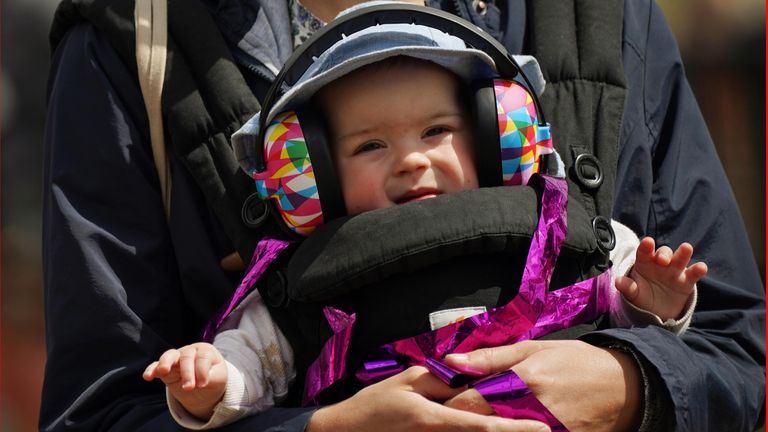 PABest A mother and child in the crowd listening to the Black Dyke Band performing on the Pyramid Stage during the Glastonbury Festival at Worthy Farm in Somerset. Picture date: Sunday June 26, 2022.

