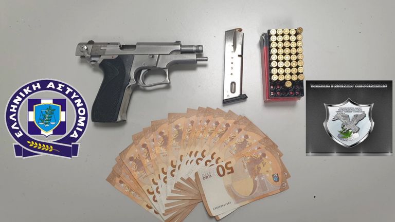 A gun and large amounts of cash were also found by Greek authorities 