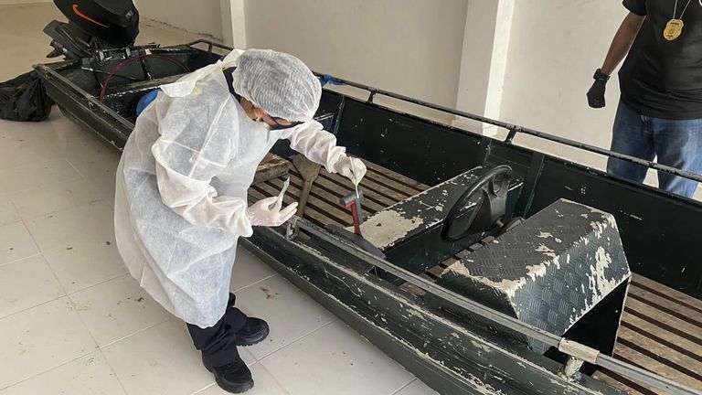 A handout photo made available by the Brazilian Federal Police shows forensic experts examining a boat with traces of blood from a suspect in the disappearances of British journalist Dom Phillips, a contributor to The Guardian newspaper, and Brazilian indigenist Bruno Araujo Pereira, who have been missing since 05 June in Vale Do Javari, Brazil, 09 June 2022.

