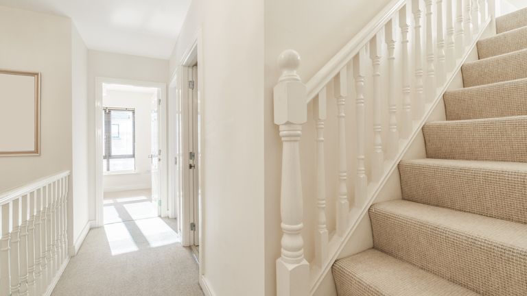 Bright small hallway with stairs in a house

