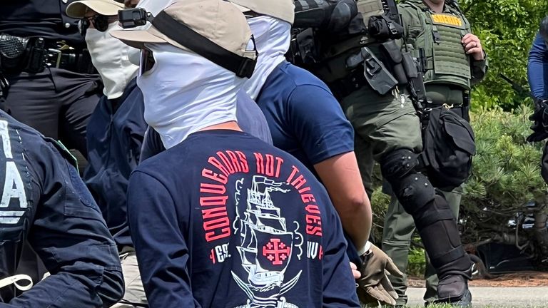 Authorities arrest members of the white supremacist group Patriot Front near an Idaho pride event Saturday, June 11, 2022, after they were found packed into the back of a U-Haul truck with riot gear. (Georji Brown via AP)


