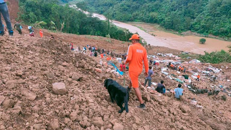NDRF personnel and others trying to rescue those buried under the debris after a mudslide in Manipur state. Pic: AP
